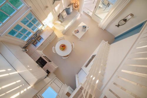 an overhead view of a kitchen and living room in a house at Ta Spitakia in Kos Town