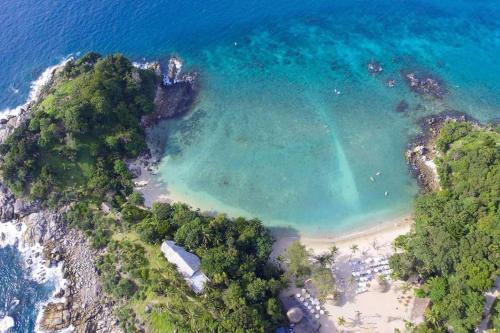 an overhead view of a beach with a rainbow in the water at Baan Heaven / Patong Beach Pool Villa Sleeps up to 15 in Patong Beach