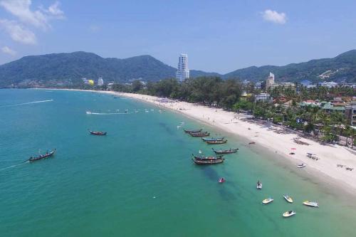 an aerial view of a beach with boats in the water at Baan Heaven / Patong Beach Pool Villa Sleeps up to 15 in Patong Beach