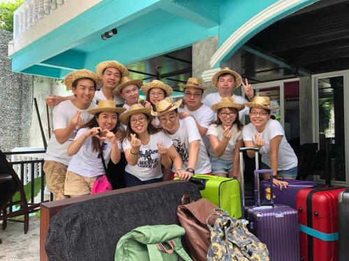 a group of people wearing hats standing next to luggage at Baan Heaven / Patong Beach Pool Villa Sleeps up to 15 in Patong Beach