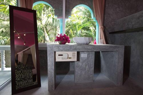 a bathroom with a counter with a bowl on it at Baan Heaven / Patong Beach Pool Villa Sleeps up to 15 in Patong Beach