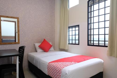 Postel nebo postele na pokoji v ubytování Hotel De' Tees, Masai Utama