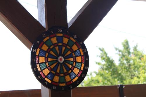 a dart board is hanging on a wall at Ubytovani Valentovi in Velké Bílovice
