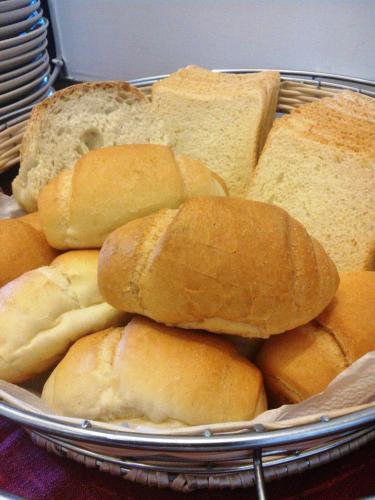 a tray filled with bread and sandwiches on a table at Hotel La Tripergola in Pozzuoli