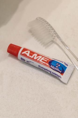 a tube of toothpaste and a toothbrush on a counter at Majestique of Naxos luxury suites in Naxos Chora