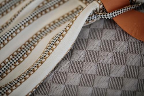 a pair of chain belts with an orange bow at Majestique of Naxos luxury suites in Naxos Chora