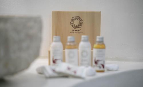 a group of bottles of milk sitting next to a box at Majestique of Naxos luxury suites in Naxos Chora