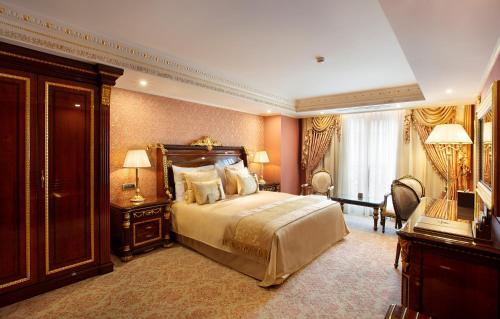 a bedroom with a large bed and two night stands at Ottoman's Life Hotel Deluxe in Istanbul