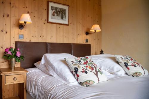 Postel nebo postele na pokoji v ubytování Le Chamois d'Or