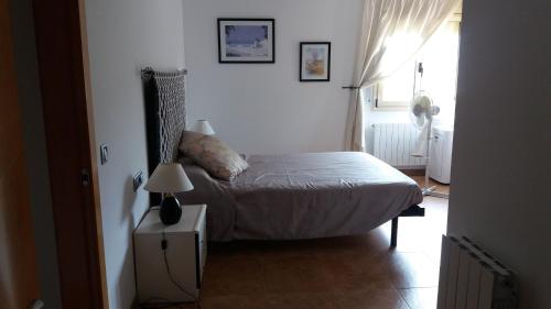 Ένα ή περισσότερα κρεβάτια σε δωμάτιο στο Casa EL PORT DE LA SELVA
