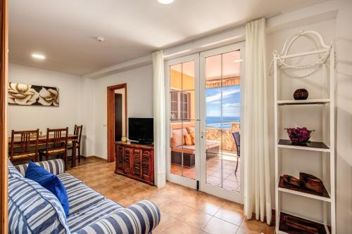 TV a/nebo společenská místnost v ubytování Granada I Apartments