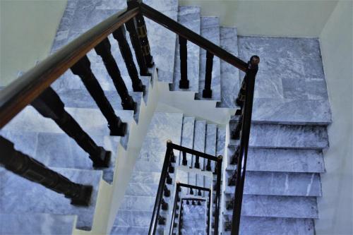 a row of stairs leading up to a staircase at Tourist Inn Hotel in Lahore
