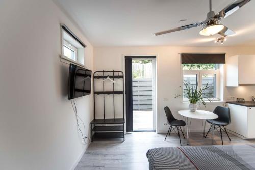 a room with a kitchen and a table and chairs at Amsterdam Beach Zandvoort Studio s in Zandvoort