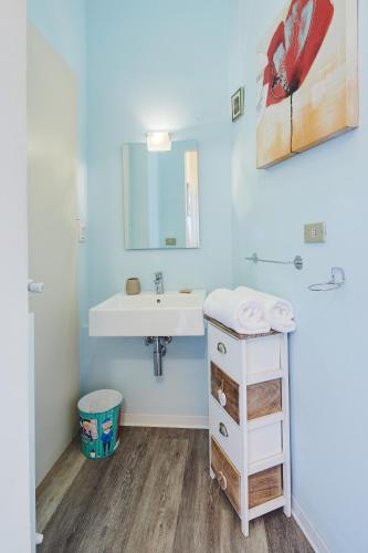 a bathroom with a sink and a mirror at Sette Note Guest House in Arezzo