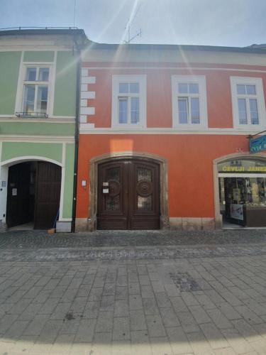 a building with two doors on the side of it at Luxory Apartment The Soul Of City in Maribor