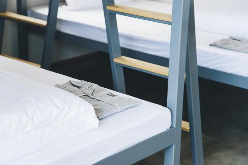 a bunk bed in a room with two bunk beds at Hotel Noum OSAKA in Osaka