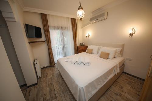 En eller flere senge i et værelse på Ağva Deniz Yıldızı Otel