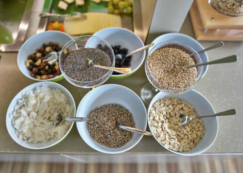 a group of bowls of food on a counter at Hotel Lindenhof in Kellberg