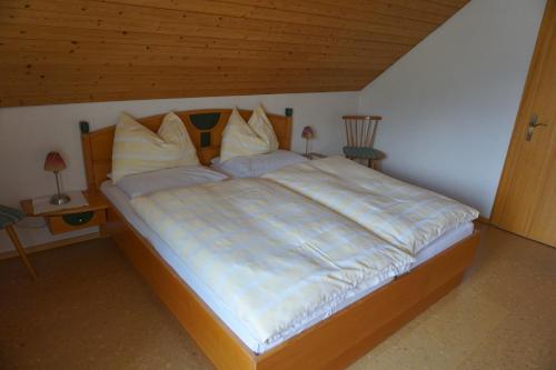 מיטה או מיטות בחדר ב-Haus Waldblick