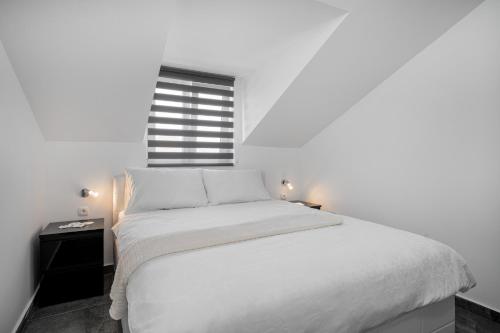 Giường trong phòng chung tại Apartments Lipic