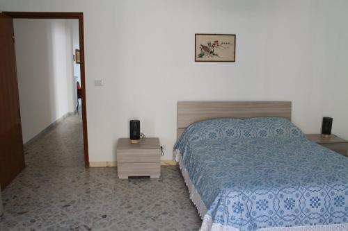 Ένα ή περισσότερα κρεβάτια σε δωμάτιο στο Casa Gialì - sea ​​view home for family