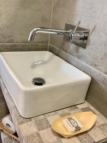 a white sink on a counter in a bathroom at Casas de Mértola - N. Sª das Neves in Mértola