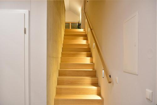 a staircase in a house with wooden floors at Ferienwohnung Sonne in Kurort Gohrisch