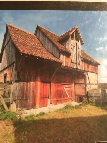 a painting of an old wooden building with a roof at Gîte Spa La grange in Kintzheim