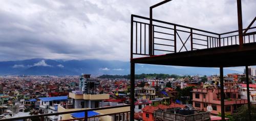 a view of a large city with buildings at Yog Hostel- Rooftop Yoga & Backpacker Social Stay in Thamel, Kathamndu in Kathmandu