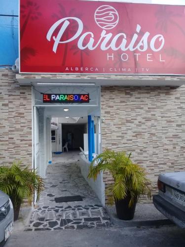 a sign for a panda hotel on the side of a building at HOTEL PARAISO ACAPULCO in Acapulco