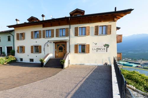 a building on the side of a hill at Agritur La Pieve in Taio