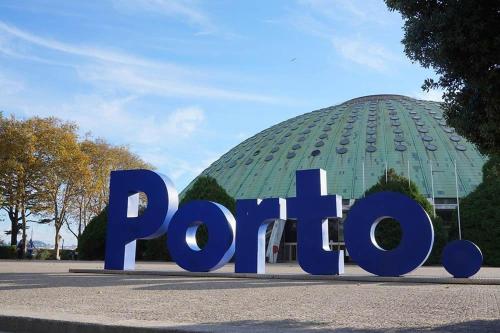 a large blue sign in front of a building at Gallo`s House in Barcelos