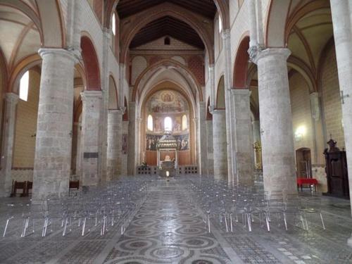 an empty room with chairs in a large building at Historical Domus in Anagni