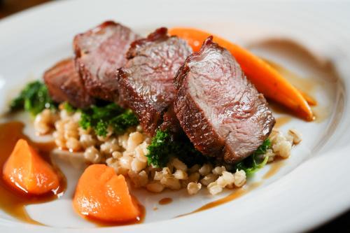 a plate of food with meat rice and carrots at Nailcote Hall in Berkswell
