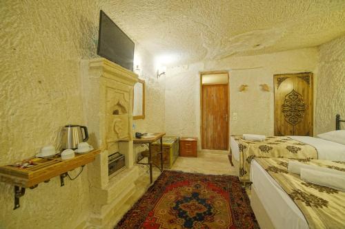 Katil atau katil-katil dalam bilik di Melek Cave Hotel