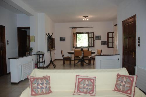 a living room with a couch and a table at Ktima Garidis in Kavála