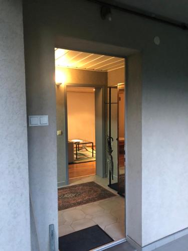 a hallway leading to a room with a table at Hava 2 in Sarajevo