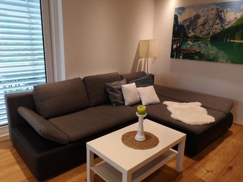 a living room with a couch and a table at Appartement Klinger in Eben im Pongau