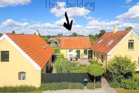 a rendering of a house with orange roofs at Cosy little guesthouse near beach & public transport in Greve Strand