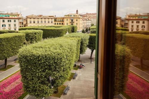 a view from a window of a city with bushes at Sette Note Guest House in Arezzo