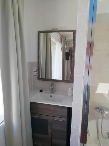 a bathroom with a sink and a mirror at Casa Cabo de Gata in Retamar