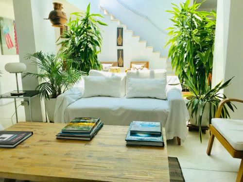 a living room with a couch and a coffee table at Penthouse Caribbean View and private pool, Cartagena in Cartagena de Indias