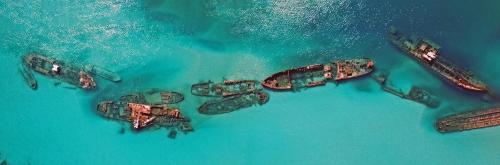 an aerial view of a group of boats in the water at Castaways Moreton Island in Bulwer