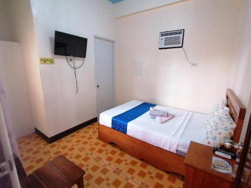 Letto o letti in una camera di Mariner's Pension House