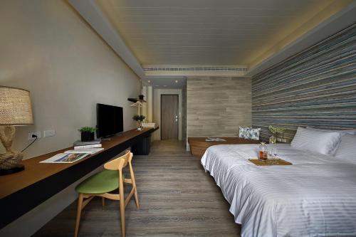 Ein Bett oder Betten in einem Zimmer der Unterkunft Sun Moon Lake Blue Sky Bay B&B