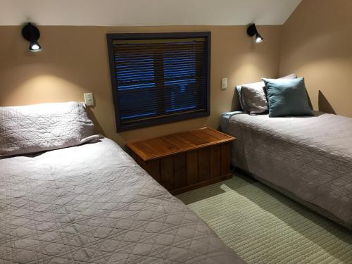Posteľ alebo postele v izbe v ubytovaní Karori Cottage