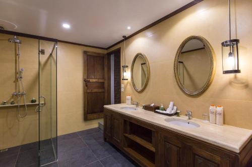 a bathroom with a sink and a shower at Plataran Borobudur in Borobudur