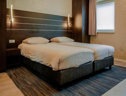 Hotel Dekkersにあるベッド