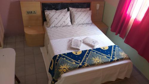 Hotel Lado Leste tesisinde bir odada yatak veya yataklar
