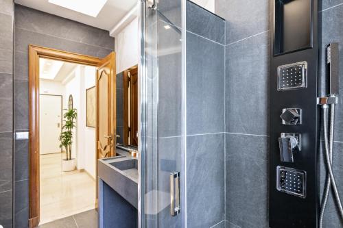 a bathroom with a shower and a sink at First Class Rome Apartments in Rome